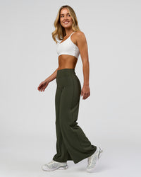 Woman wearing Elixir High-Rise Petite Pant - Pure Olive | Model:Issy | Size:XS | Thumbnail Index: 6