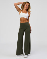 Woman wearing Elixir High-Rise Petite Pant - Pure Olive | Model:Issy | Size:XS | Thumbnail Index: 5
