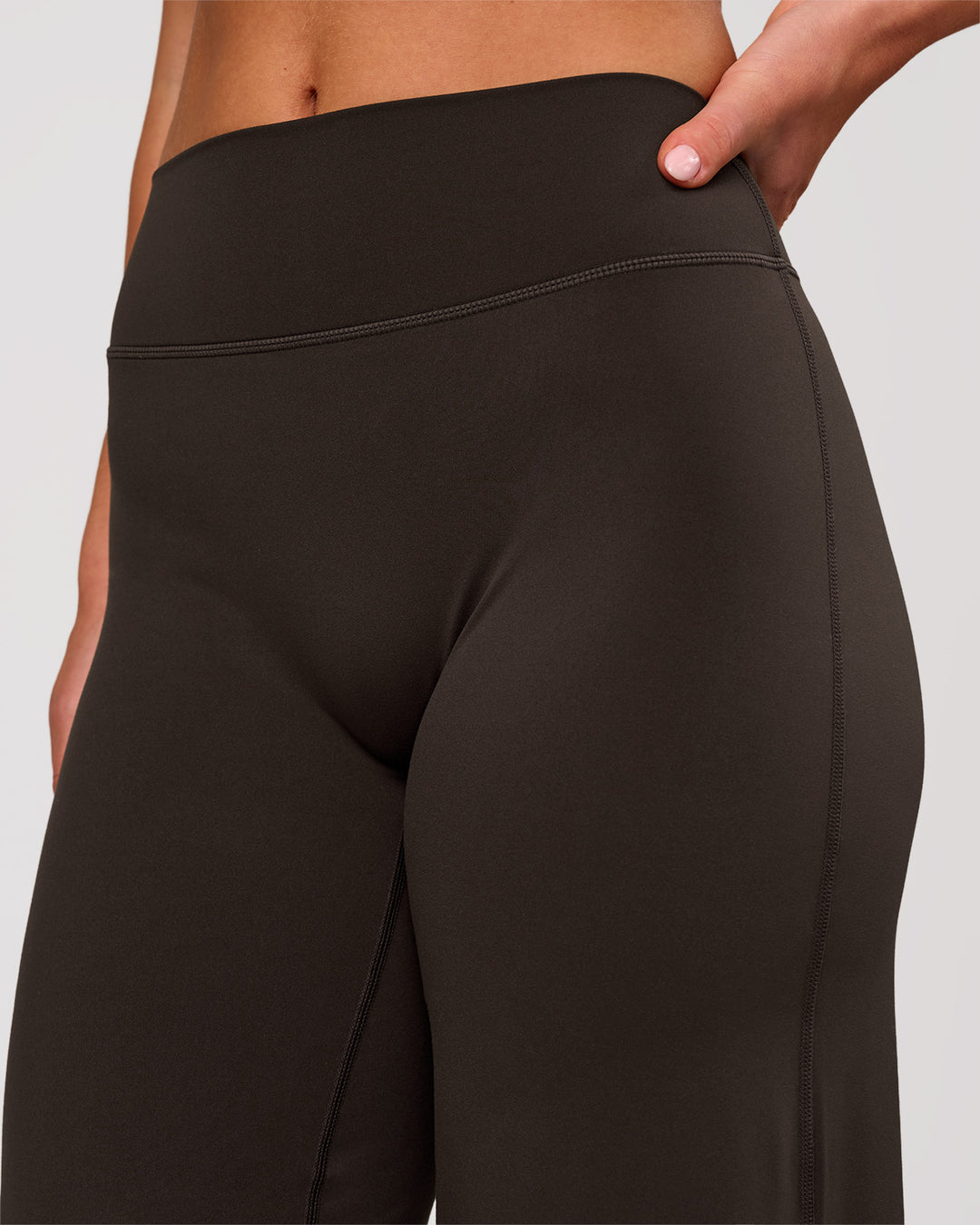 Woman wearing Elixir High-Rise Petite Pant - Ground Coffee | Model:Issy | Size:XS - view 6