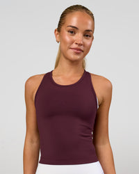 Woman wearing Flow Performance Tank 2.0 - Cherry Lacquer | Model:Issy | Size:XS | Thumbnail Index: 0