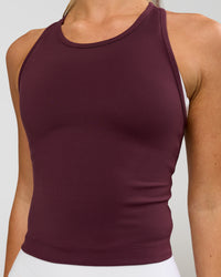Woman wearing Flow Performance Tank 2.0 - Cherry Lacquer | Model:Issy | Size:XS | Thumbnail Index: 1