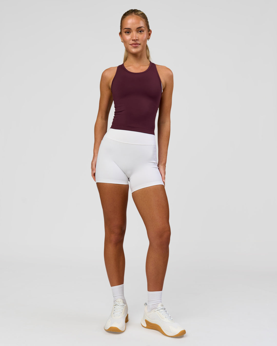 Woman wearing Flow Performance Tank 2.0 - Cherry Lacquer | Model:Issy | Size:XS - view 5