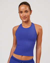 Woman wearing Flow Performance Tank 2.0 - Power Cobalt | Model:Issy | Size:XS | Thumbnail Index: 0
