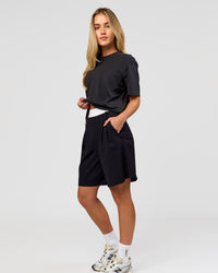 Woman wearing Benchmark FLXCotton Oversized Tee - Onyx-Yellow Fizz | Model:Issy | Size:XS | Thumbnail Index: 16
