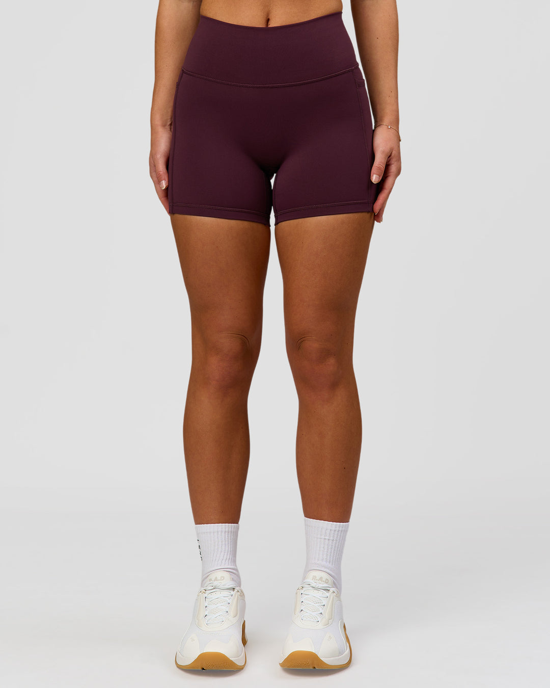 Woman wearing Fusion High-Rise 4" Short Pockets - Cherry Lacquer | Model:Issy | Size:XS - view 3