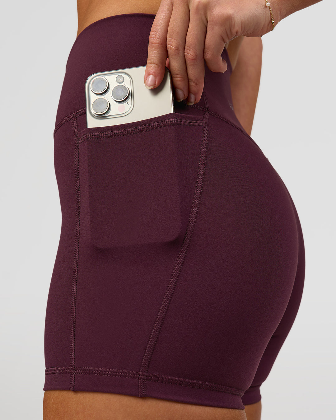 Woman wearing Fusion High-Rise 4" Short Pockets - Cherry Lacquer | Model:Issy | Size:XS - view 4