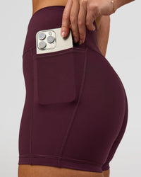 Woman wearing Fusion High-Rise 4" Short Pockets - Cherry Lacquer | Model:Issy | Size:XS | Thumbnail Index: 3