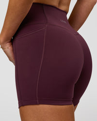 Woman wearing Fusion High-Rise 4" Short Pockets - Cherry Lacquer | Model:Issy | Size:XS | Thumbnail Index: 4