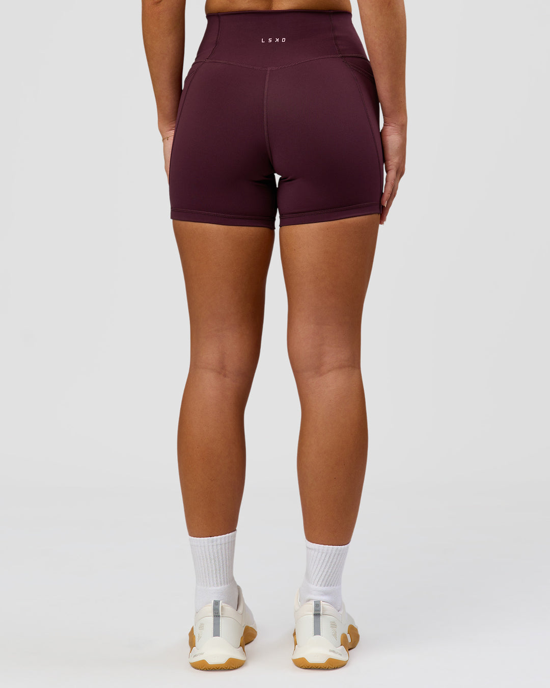 Woman wearing Fusion High-Rise 4" Short Pockets - Cherry Lacquer | Model:Issy | Size:XS - view 8