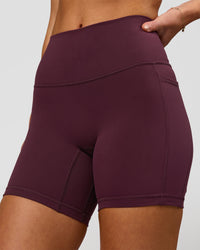 Woman wearing Fusion High-Rise 6" Short Pockets - Cherry Lacquer | Model:Issy | Size:XS | Thumbnail Index: 1