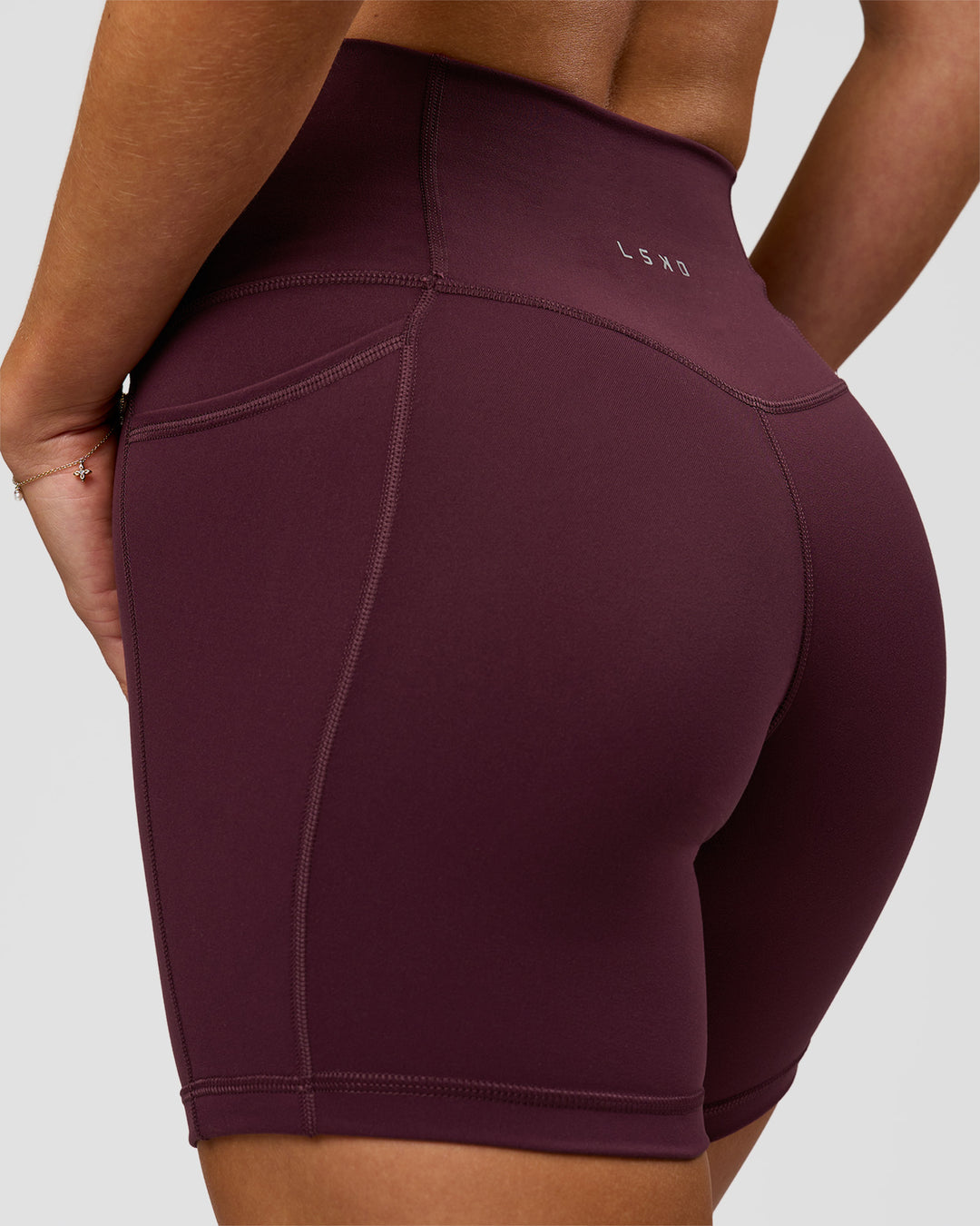 Woman wearing Fusion High-Rise 6" Short Pockets - Cherry Lacquer | Model:Issy | Size:XS - view 3