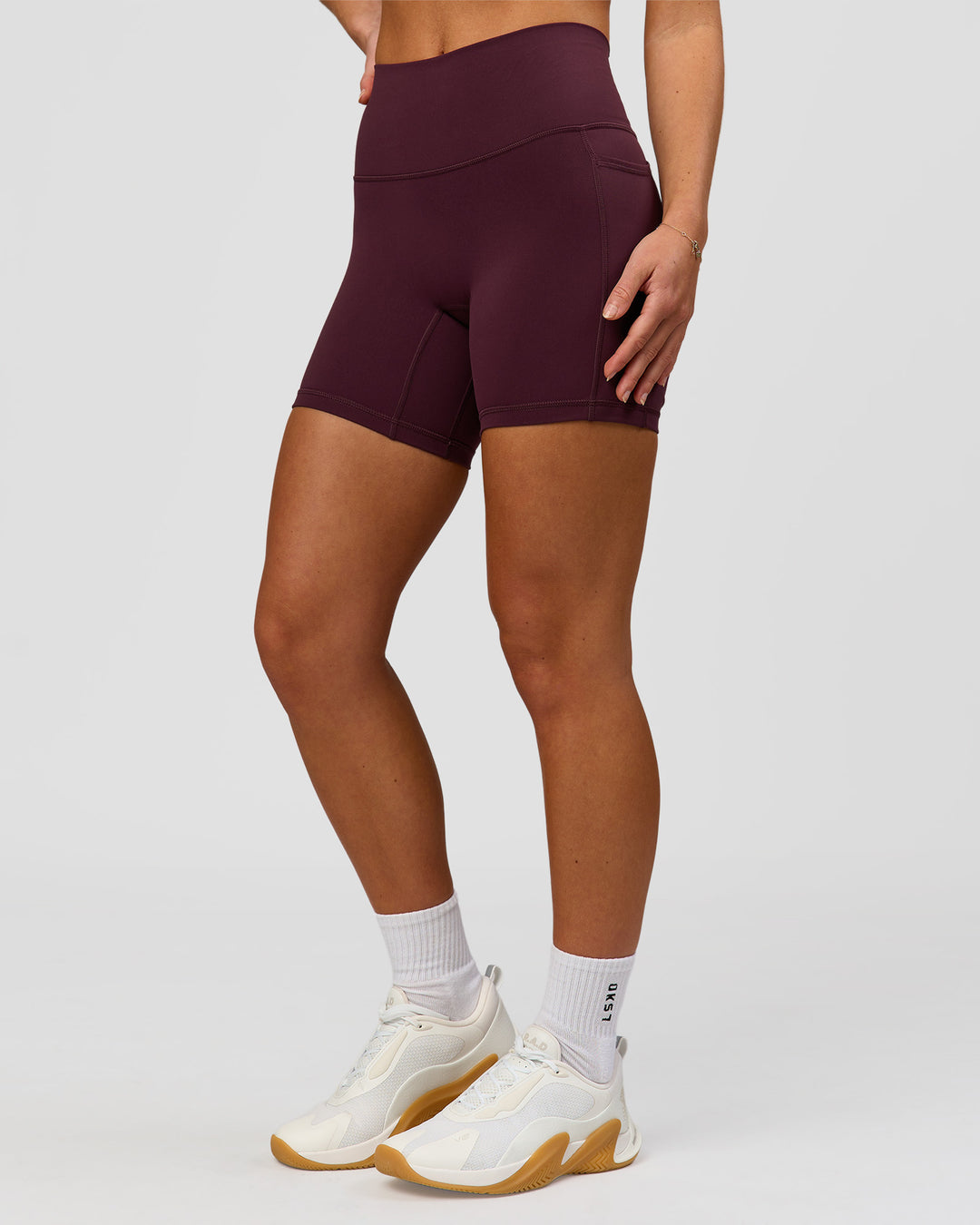 Woman wearing Fusion High-Rise 6" Short Pockets - Cherry Lacquer | Model:Issy | Size:XS - view 4