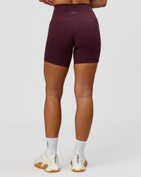 Woman wearing Fusion High-Rise 6" Short Pockets - Cherry Lacquer | Model:Issy | Size:XS | Thumbnail Index: 4
