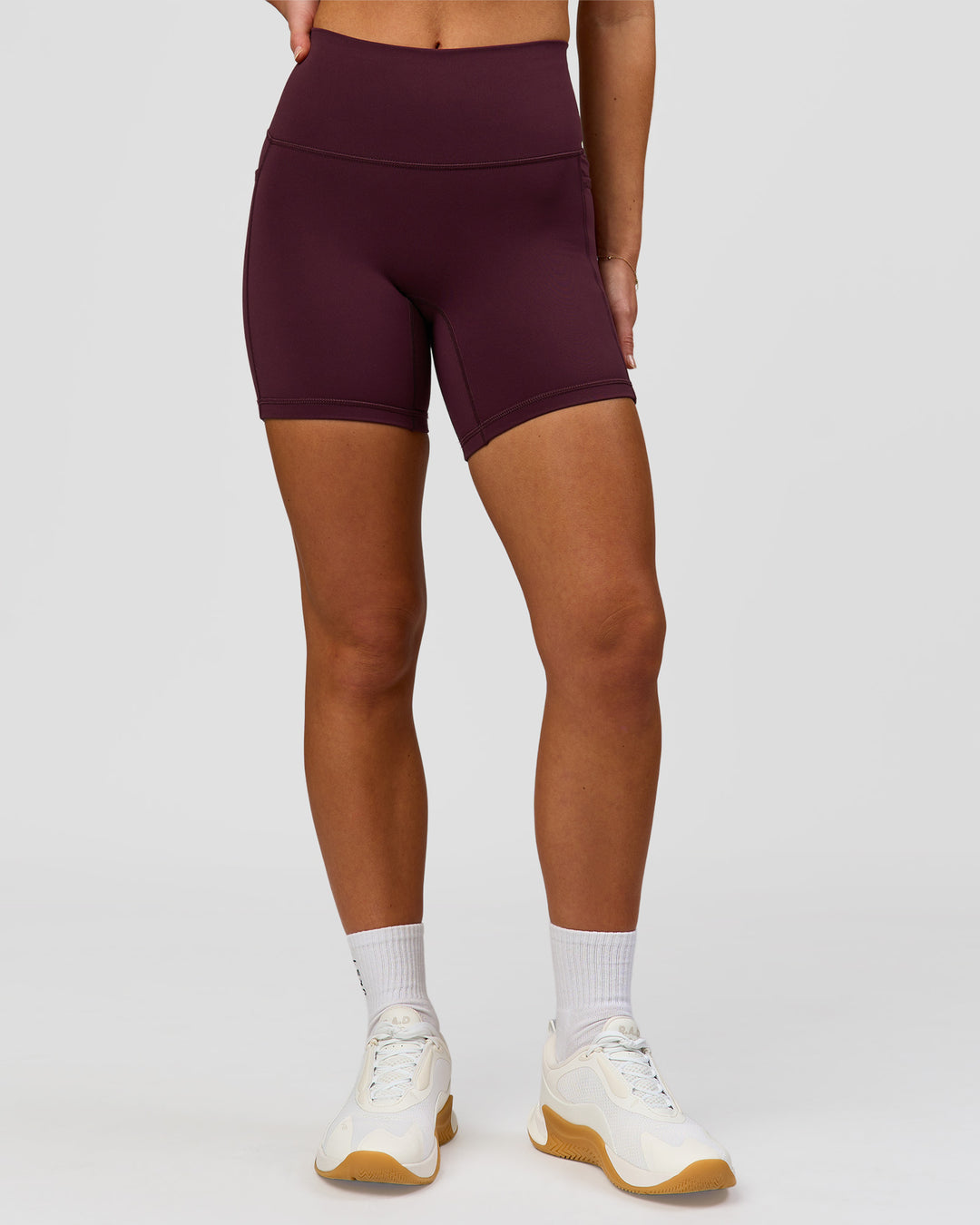 Woman wearing Fusion High-Rise 6" Short Pockets - Cherry Lacquer | Model:Issy | Size:XS - view 6