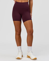 Woman wearing Fusion High-Rise 6" Short Pockets - Cherry Lacquer | Model:Issy | Size:XS | Thumbnail Index: 5