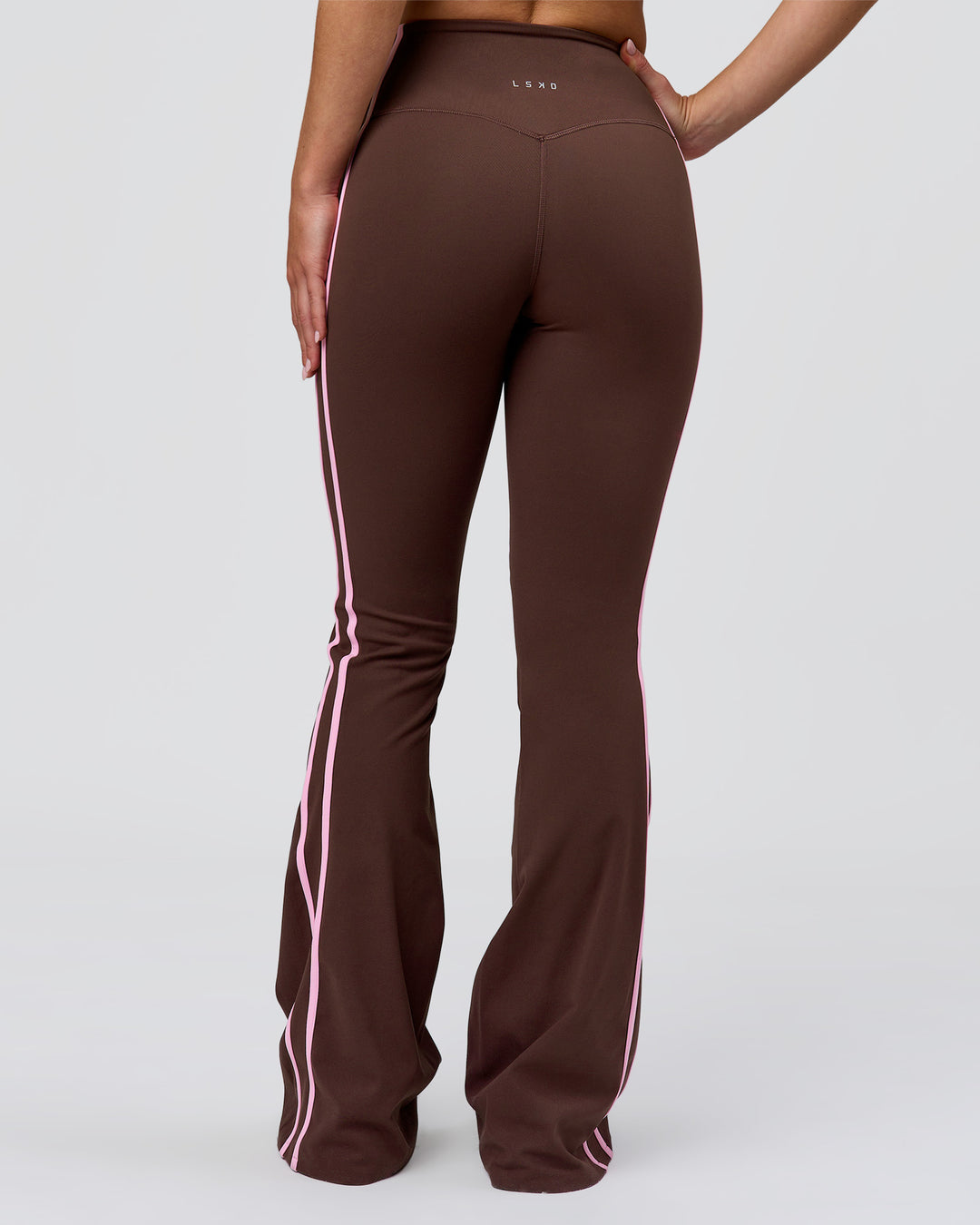 Woman wearing Fusion V-Contour Bind High-Rise Flared Legging - Hot Chocolate-Pink Rose | Model:Issy | Size:XS - view 7