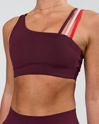 Woman wearing Galvanise Sports Bra 2.0 - Cherry Lacquer-Multi | Model:Issy | Size:XS | Thumbnail Index: 0