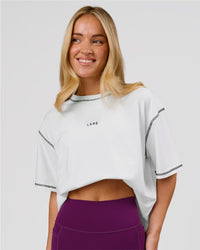 Woman wearing Go-To Contrast Oversized Heavyweight FLXCotton Tee - White-Black | Model:Issy | Size:XS | Thumbnail Index: 0