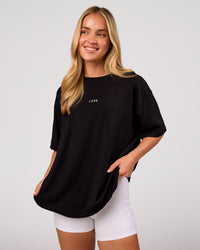 Woman wearing Go-To FLXCotton Oversized Tee - Black-White | Model:Issy | Size:XS | Thumbnail Index: 0