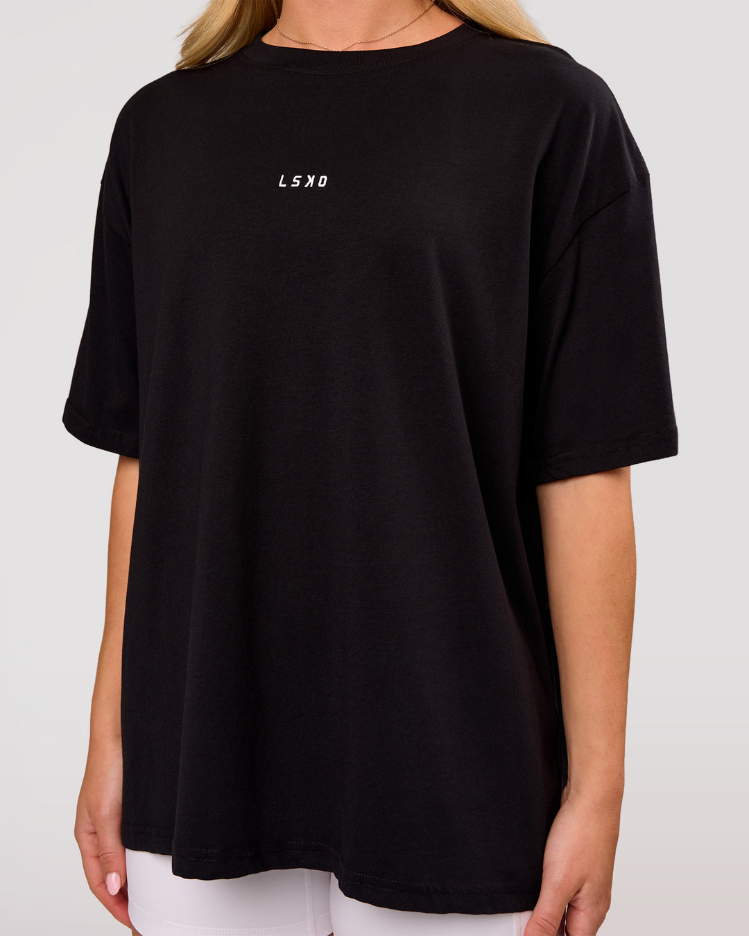 Woman wearing Go-To FLXCotton Oversized Tee - Black-White | Model:Issy | Size:XS - view 2