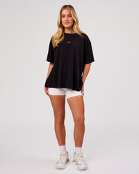 Woman wearing Go-To FLXCotton Oversized Tee - Black-White | Model:Issy | Size:XS | Thumbnail Index: 3