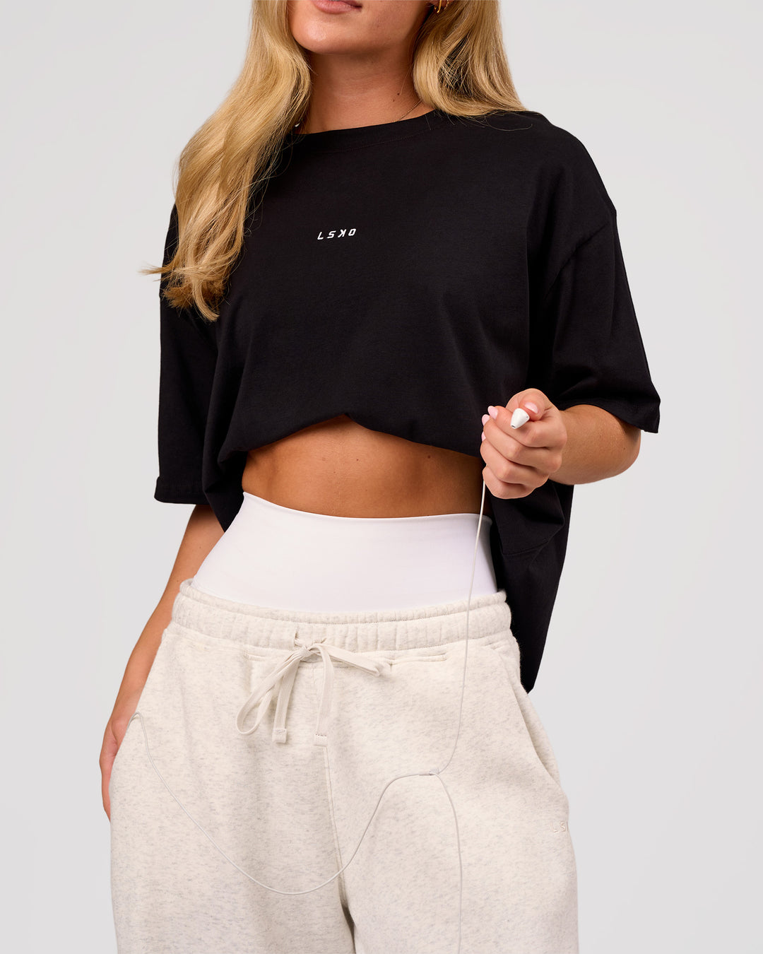 Woman wearing Go-To FLXCotton Oversized Tee - Black-White | Model:Issy | Size:XS - view 7
