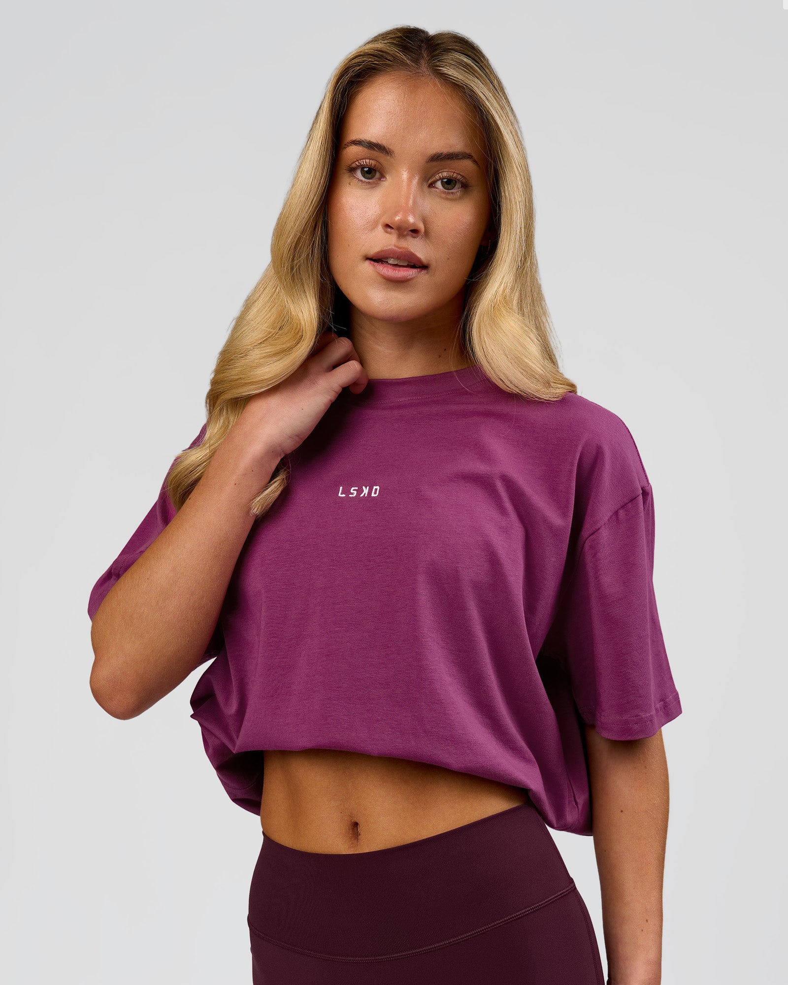 Woman wearing Go-To FLXCotton Oversized Tee - Boysenberry-White | Model:Issy | Size:XS