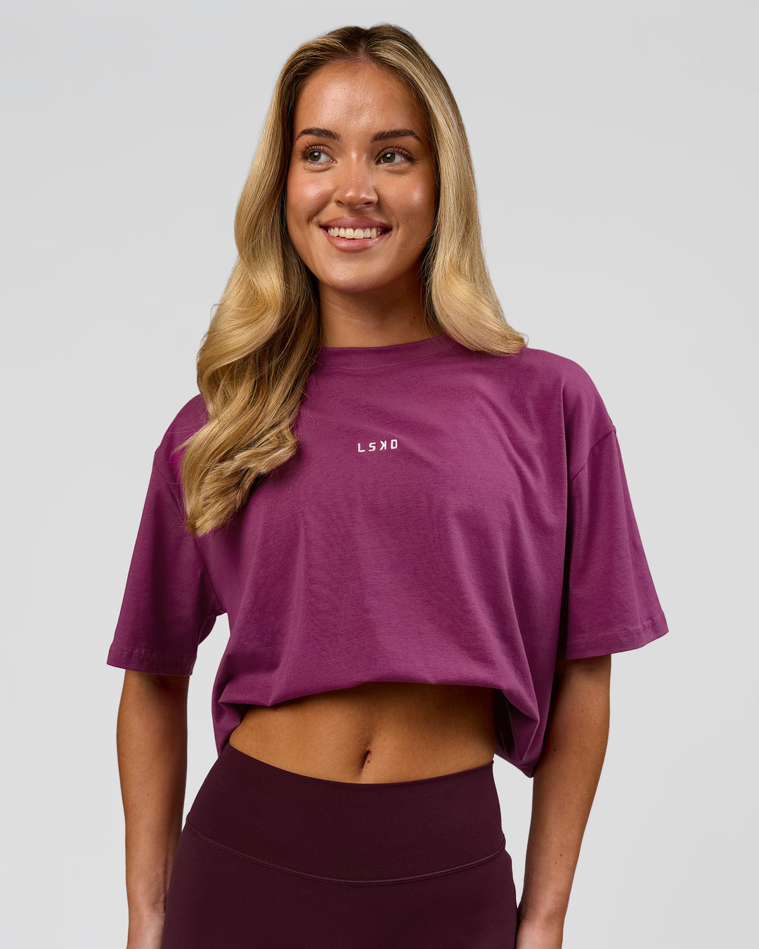 Woman wearing Go-To FLXCotton Oversized Tee - Boysenberry-White | Model:Issy | Size:XS - view 6