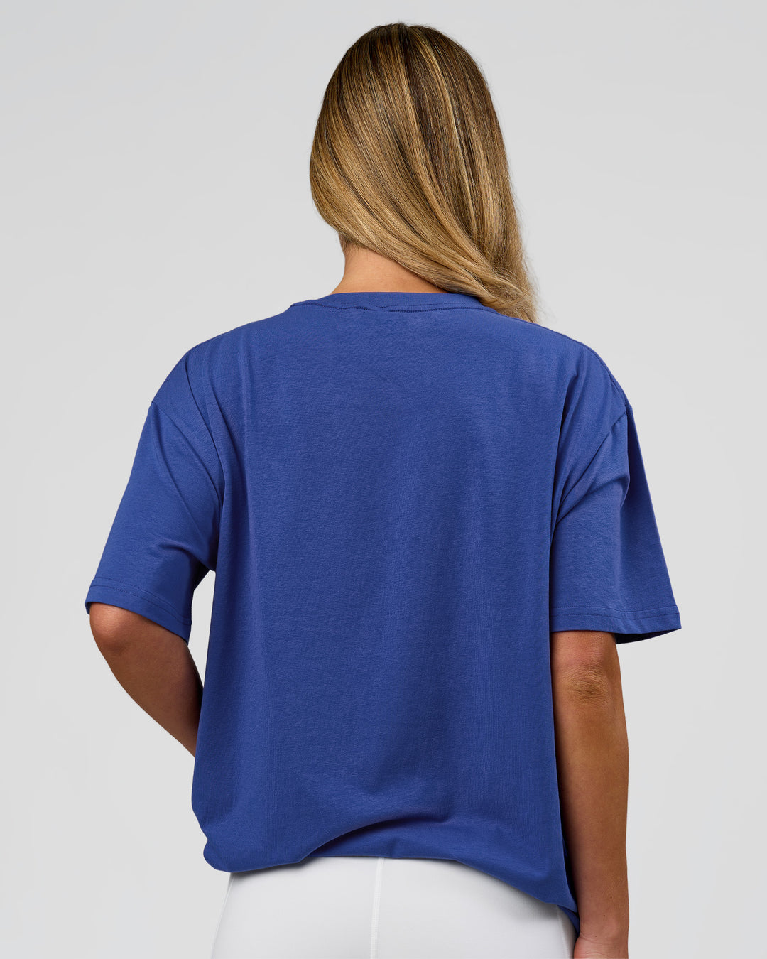 Woman wearing Go-To FLXCotton Oversized Tee - Power Cobalt-White | Model:Issy | Size:XS - view 8