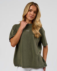 Woman wearing Go-To FLXCotton Oversized Tee - Pure Olive Washed | Model:Issy | Size:XS | Thumbnail Index: 0