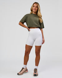 Woman wearing Go-To FLXCotton Oversized Tee - Pure Olive Washed | Model:Issy | Size:XS | Thumbnail Index: 5