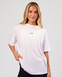 Woman wearing Go-To FLXCotton Oversized Tee - White-Black | Model:Issy | Size:XS | Thumbnail Index: 0