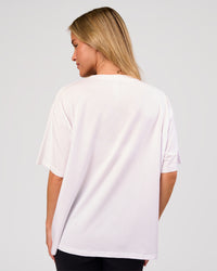 Woman wearing Go-To FLXCotton Oversized Tee - White-Black | Model:Issy | Size:XS | Thumbnail Index: 2