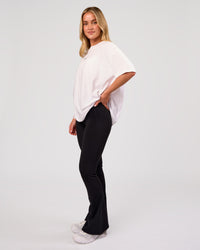Woman wearing Go-To FLXCotton Oversized Tee - White-Black | Model:Issy | Size:XS | Thumbnail Index: 4
