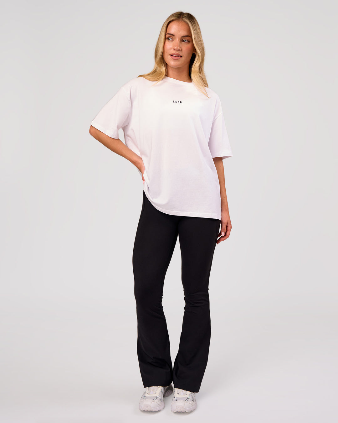Woman wearing Go-To FLXCotton Oversized Tee - White-Black | Model:Issy | Size:XS - view 6