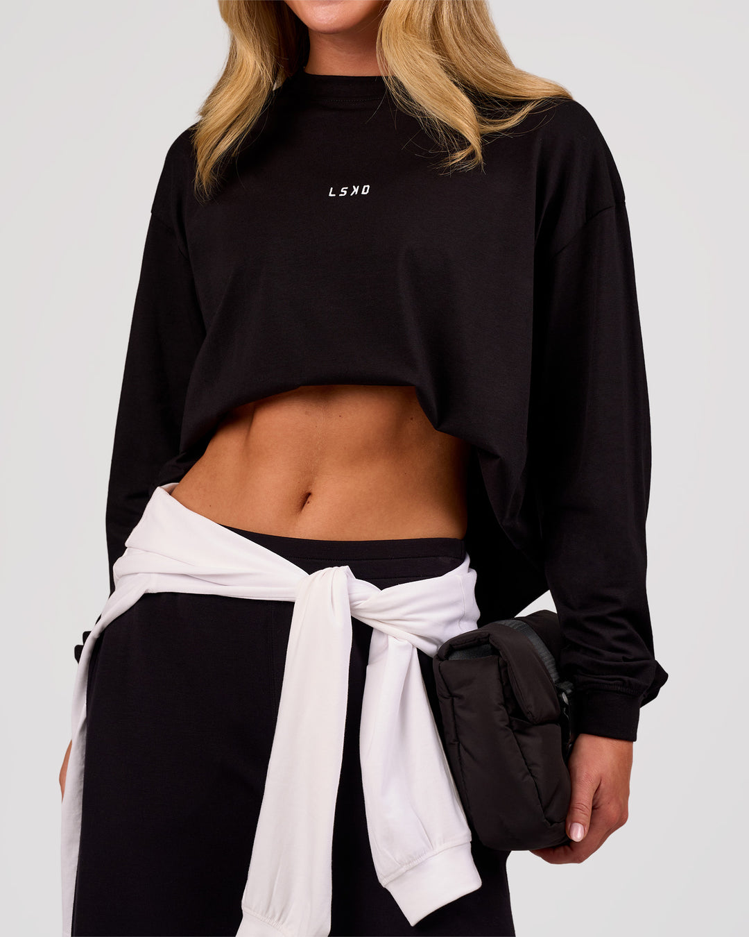 Woman wearing Go-To Long Sleeve FLXCotton Oversized Tee - Black-White | Model:Issy | Size:XS - view 3