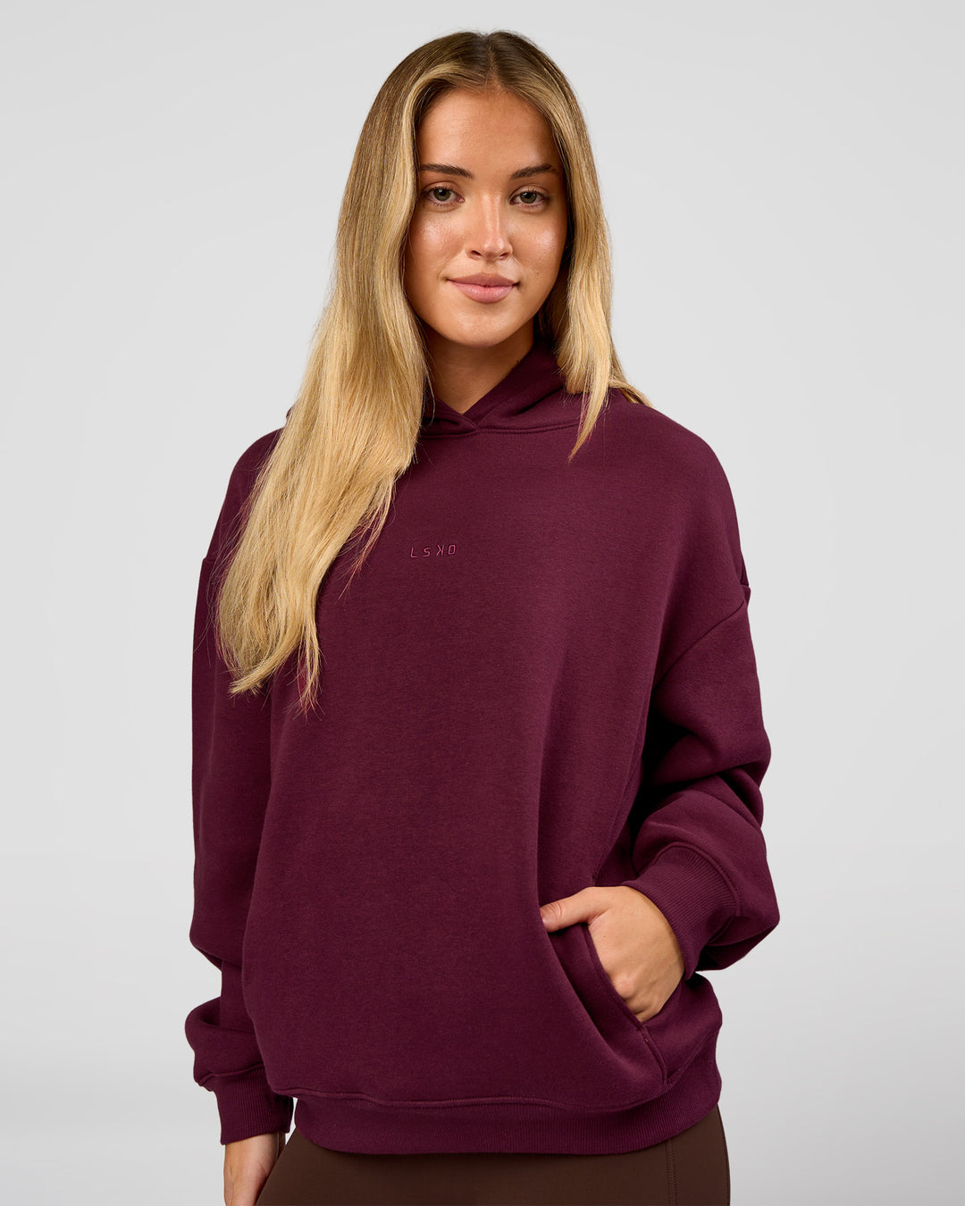Woman wearing Go-To Oversized Hoodie - Cherry Lacquer | Model:Issy | Size:XS - view 1