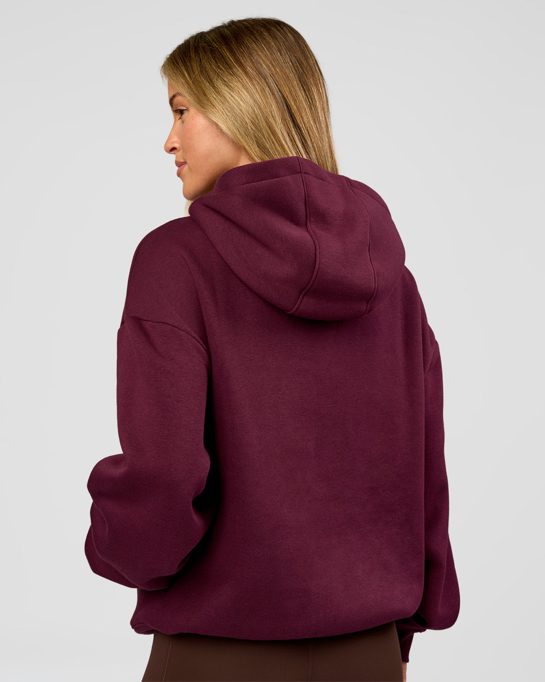 Woman wearing Go-To Oversized Hoodie - Cherry Lacquer | Model:Issy | Size:XS - view 2