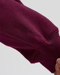 Woman wearing Go-To Oversized Hoodie - Cherry Lacquer | Model:Issy | Size:XS | Thumbnail Index: 3