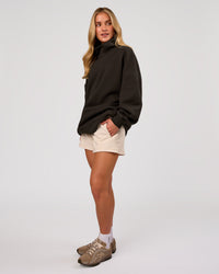 Woman wearing Go-To Oversized Mock Neck Sweater - Ground Coffee | Model:Issy | Size:XS | Thumbnail Index: 6
