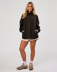 Woman wearing Go-To Oversized Mock Neck Sweater - Ground Coffee | Model:Issy | Size:XS | Thumbnail Index: 8