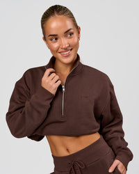 Woman wearing Go-To Oversized Quarter Zip Sweater - Hot Chocolate | Model:Issy | Size:XS | Thumbnail Index: 0