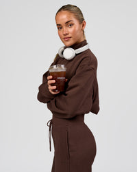Woman wearing Go-To Oversized Quarter Zip Sweater - Hot Chocolate | Model:Issy | Size:XS | Thumbnail Index: 2