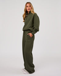 Woman wearing Go-To Oversized Quarter Zip Sweater - Pure Olive | Model:Issy | Size:XS | Thumbnail Index: 4