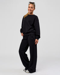 Woman wearing Go-To Oversized Sweater - Black | Model:Issy | Size:XS | Thumbnail Index: 5