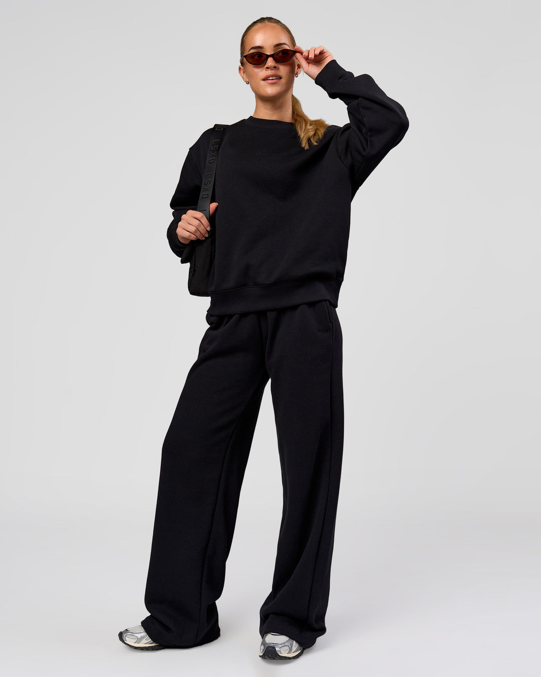 Woman wearing Go-To Oversized Sweater - Black | Model:Issy | Size:XS - view 3