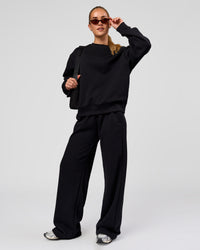 Woman wearing Go-To Oversized Sweater - Black | Model:Issy | Size:XS | Thumbnail Index: 2