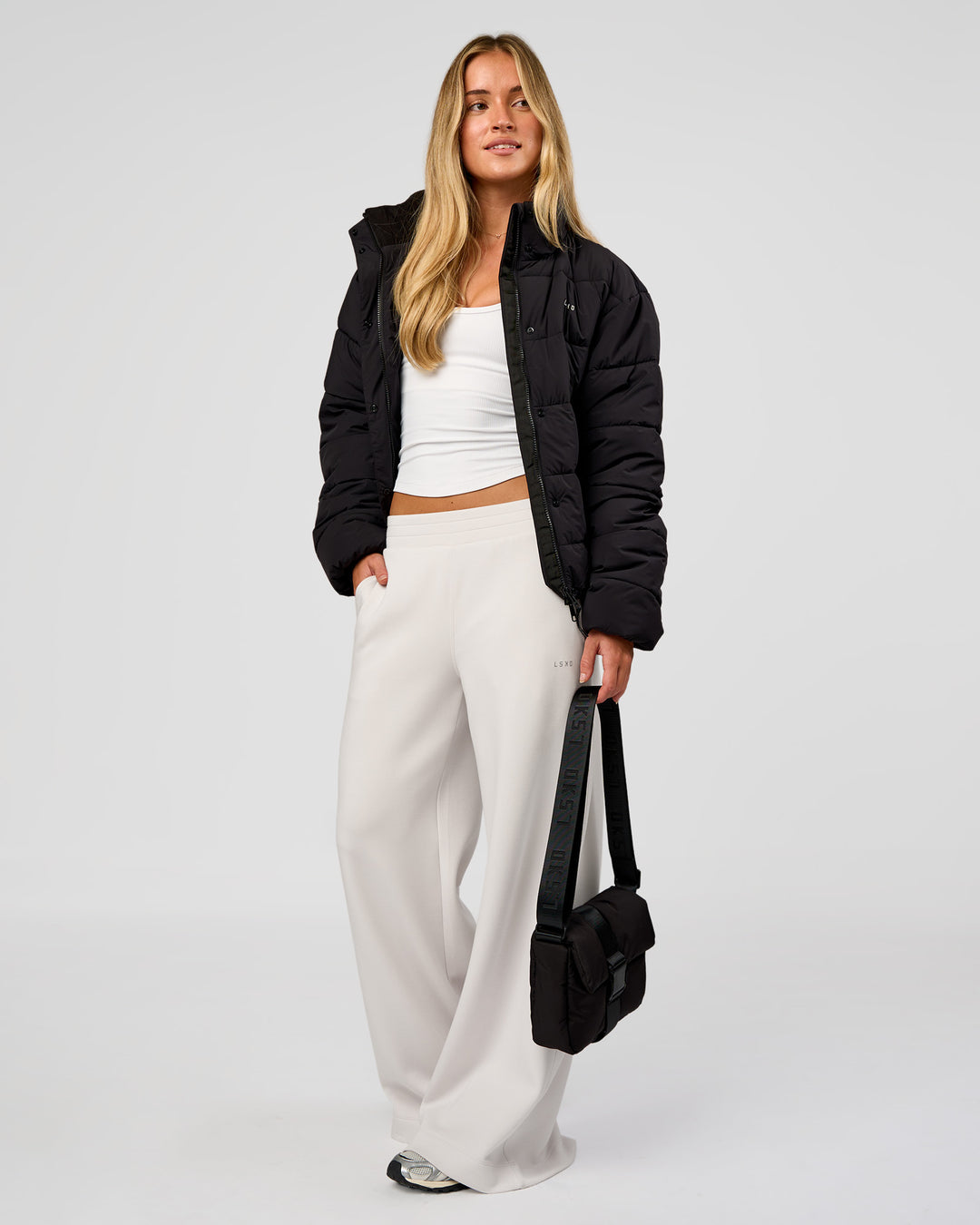 Woman wearing Go-To Puffer Jacket - Black | Model:Issy | Size:XS - view 11