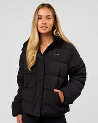Woman wearing Go-To Puffer Jacket - Black | Model:Issy | Size:XS | Thumbnail Index: 0