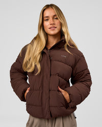 Woman wearing Go-To Puffer Jacket - Hot Chocolate | Model:Issy | Size:XS | Thumbnail Index: 0